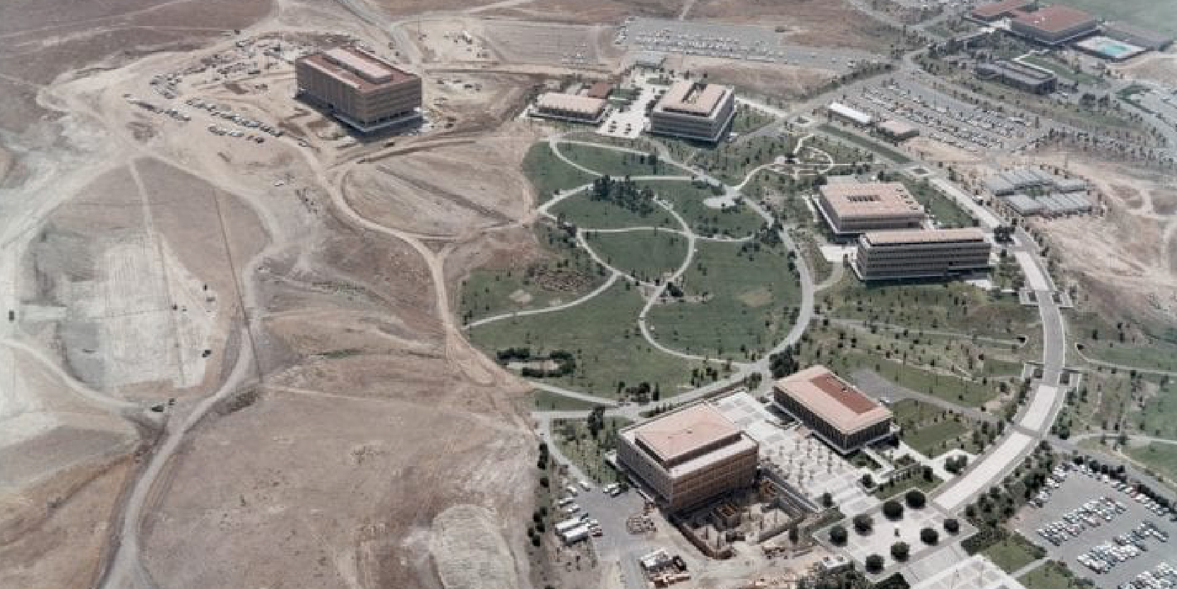 An aerial view of UC Irvine in 1968 shows the circular hub about half completed